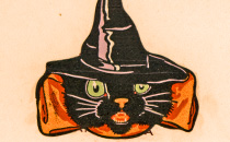 Drawing of a black cat in a witch costume.