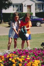 Photo of girls watering flowers