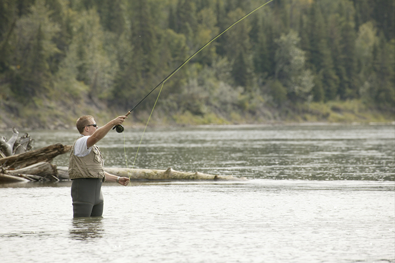 man fishing in river