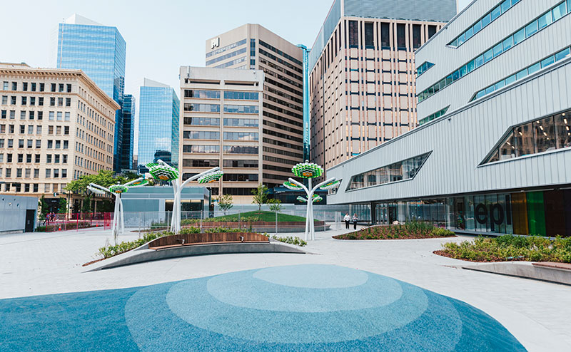 centennial plaza wide shot with buildings and art installations