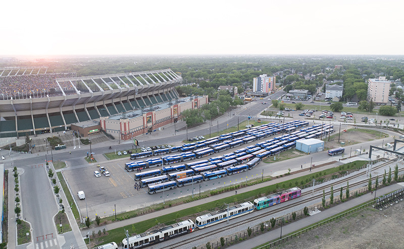Aerial view of Commonwealth Stadium with ETS buses and LRT in foreground