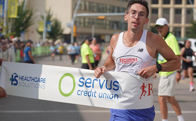 runner crossing finish line