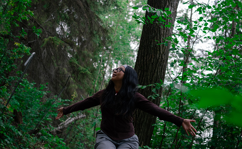 person in forest sitting