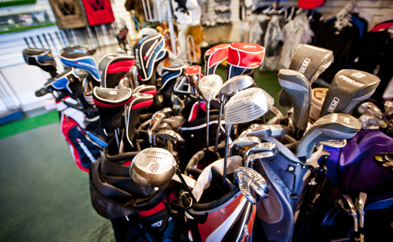 Various golf clubs in golf bags