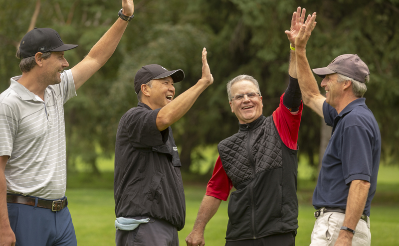 Golfers high-fiving