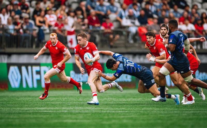 rugby players running on field