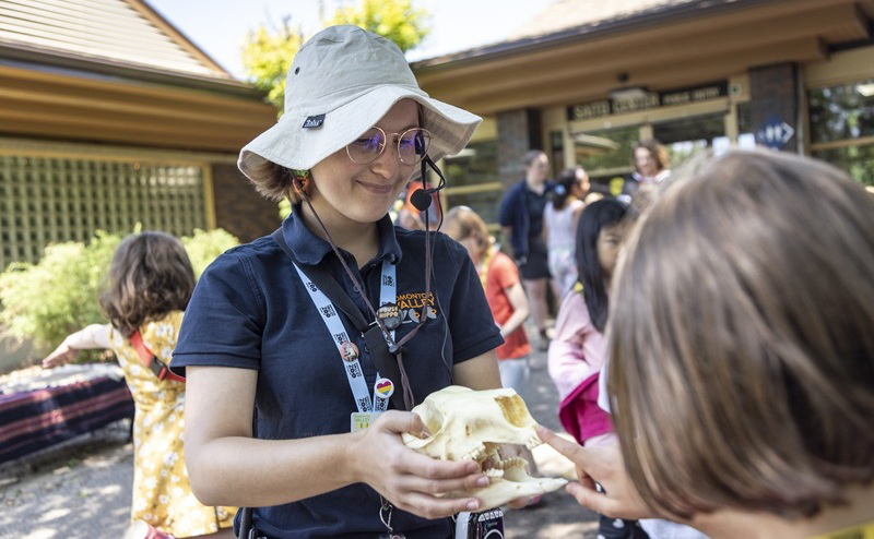 An Zoo interpreter showing a child an artifact