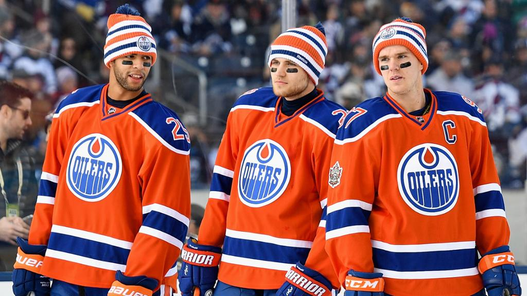 Three Edmonton Oilers hockey players.