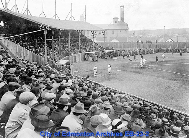 Bleachers filled with people watching a baseball game.