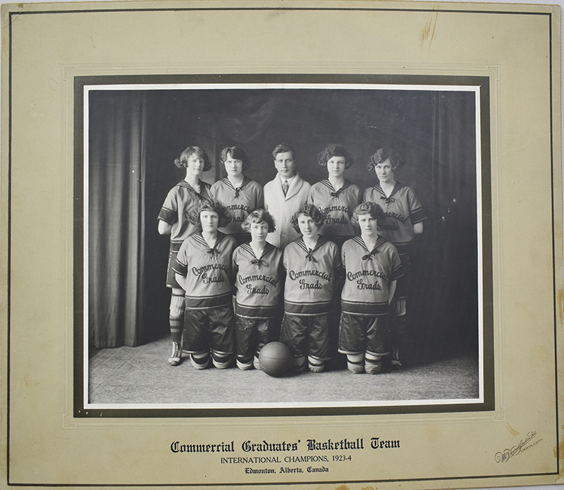Black and white photo of the Edmonton Grads. An inscription reads: "Commercial Graduates' Basketball Team International Champions, 1923-4 Edmonton, Alberta, Canada"