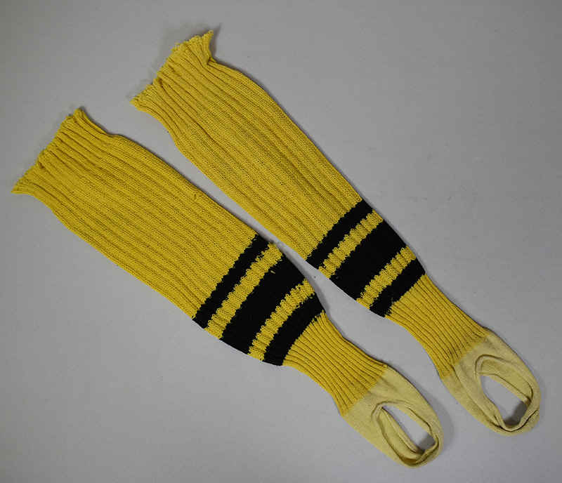 Yellow socks with black stripes.
