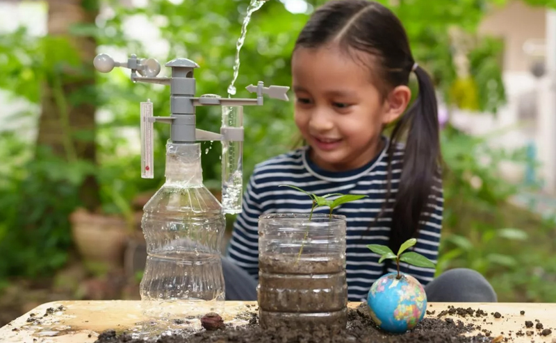 Young girl looking at a science experiment