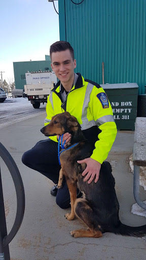 Animal Control Peace Officer Isaac Firt with Terra, the dog he rescued on Christmas Eve 2019.