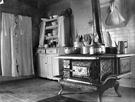 A kitchen from 1917 featuring an old coal  powered oven.