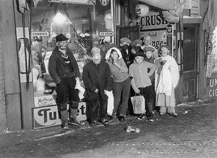 Children dressed in costumes, posing for the picture.