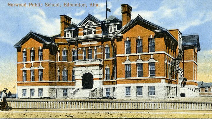An orange coloured three storey school.