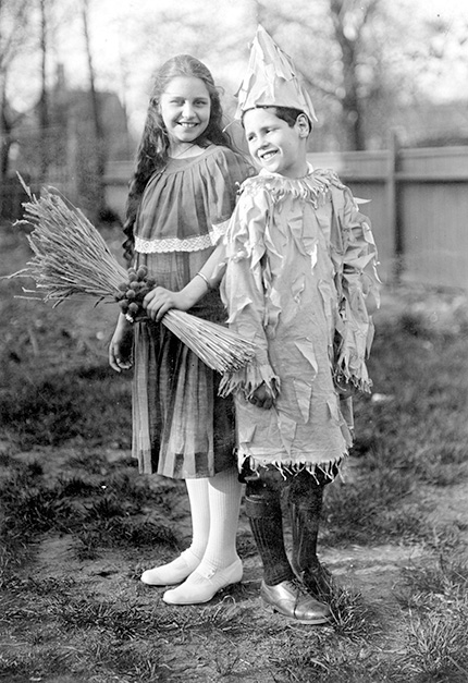 A boy and girl in their Halloween costumes in 1915.