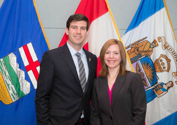 Mayor Iveson and Historian Laureate Metcalfe-Chenail pose in front of the Alberta, Canada and City of Edmonton flags at the April 15, 2014 Council Protocol.
