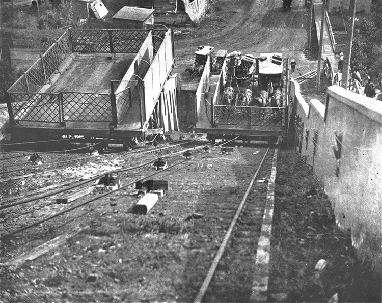 A short railway on a steep hill, with horse-drawn carriages on the lift.