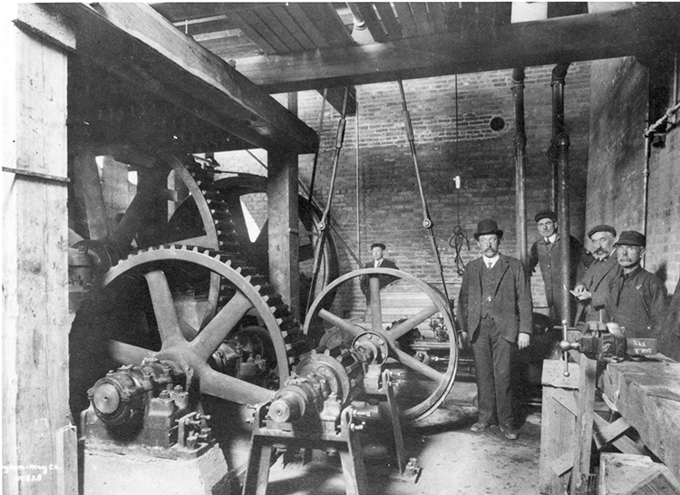 The hoist room for the Edmonton Incline Railway, which has several large gears and pullleys.