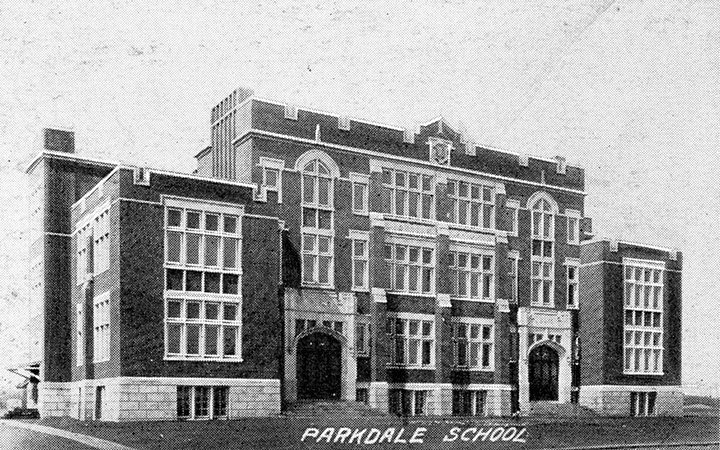 Black and white photo. A large multi-story school building with two entrances in front. Text overlaid at the bottom of the photo reads "Parkdale School".