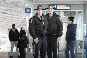 A pair of Transit peace officers who can be found on the system or called for using the emergency phone found on LRT platforms