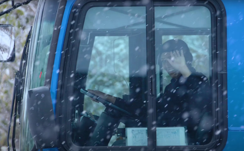 Bus driver waving out window