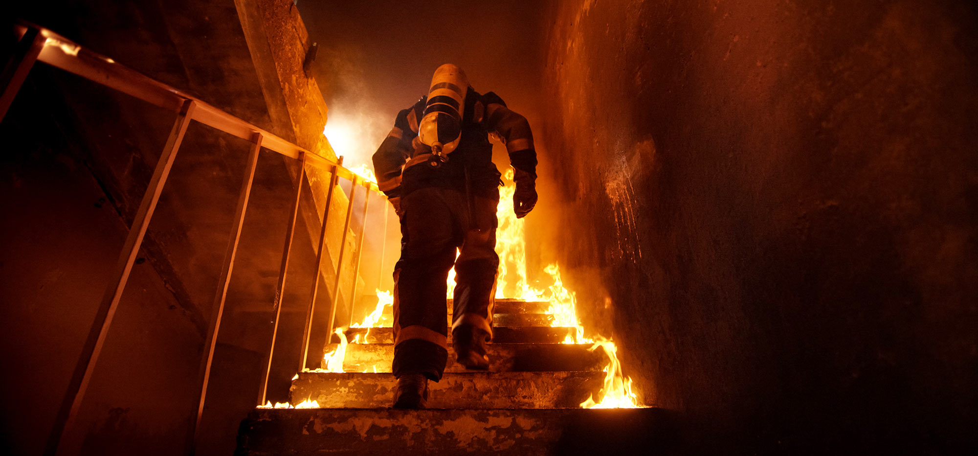Firefighter climbing stairs