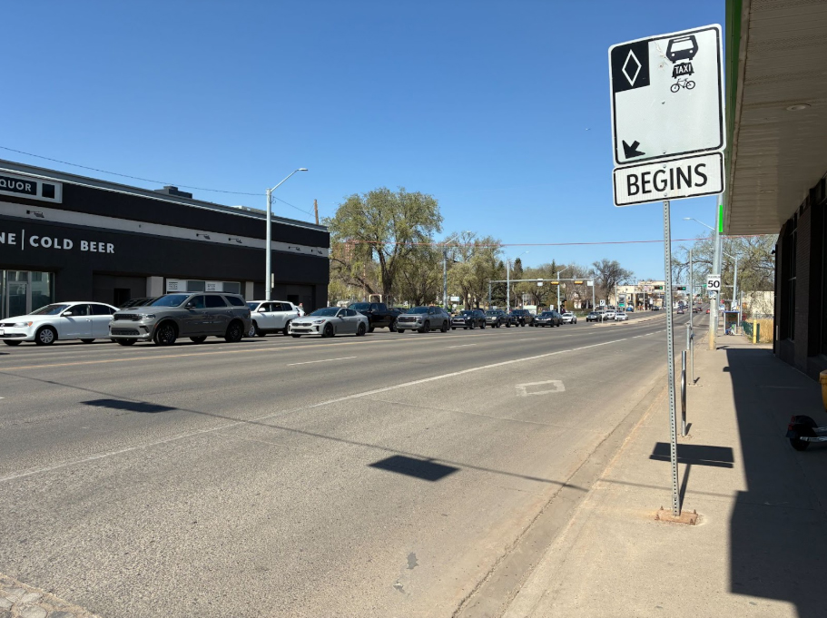 A northbound dedicated curb lane for transit, ride-share and bicycles on 109 Street near 82 Avenue