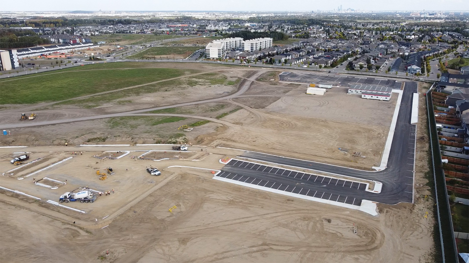 Southwest view of the site showing concrete and asphalt paving scopes for the Early Works project