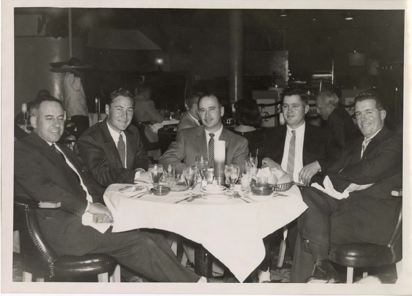 Black and white photo of J.N. Stephens, G.W. Golden, and three other men sitting around a table.
