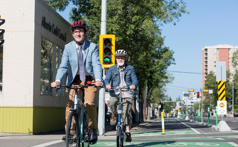 Family cycling on a downtown street