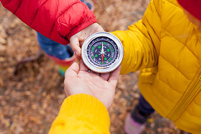 hands holding a compass