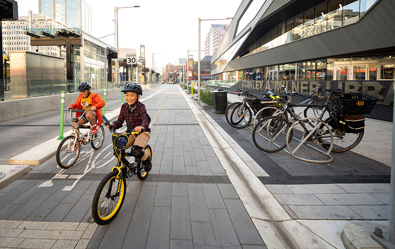 kids riding bikes downtown