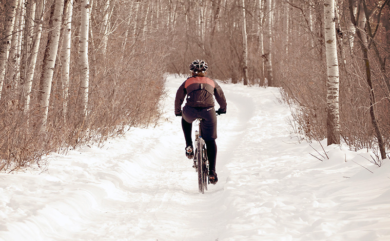 person riding bike in winter