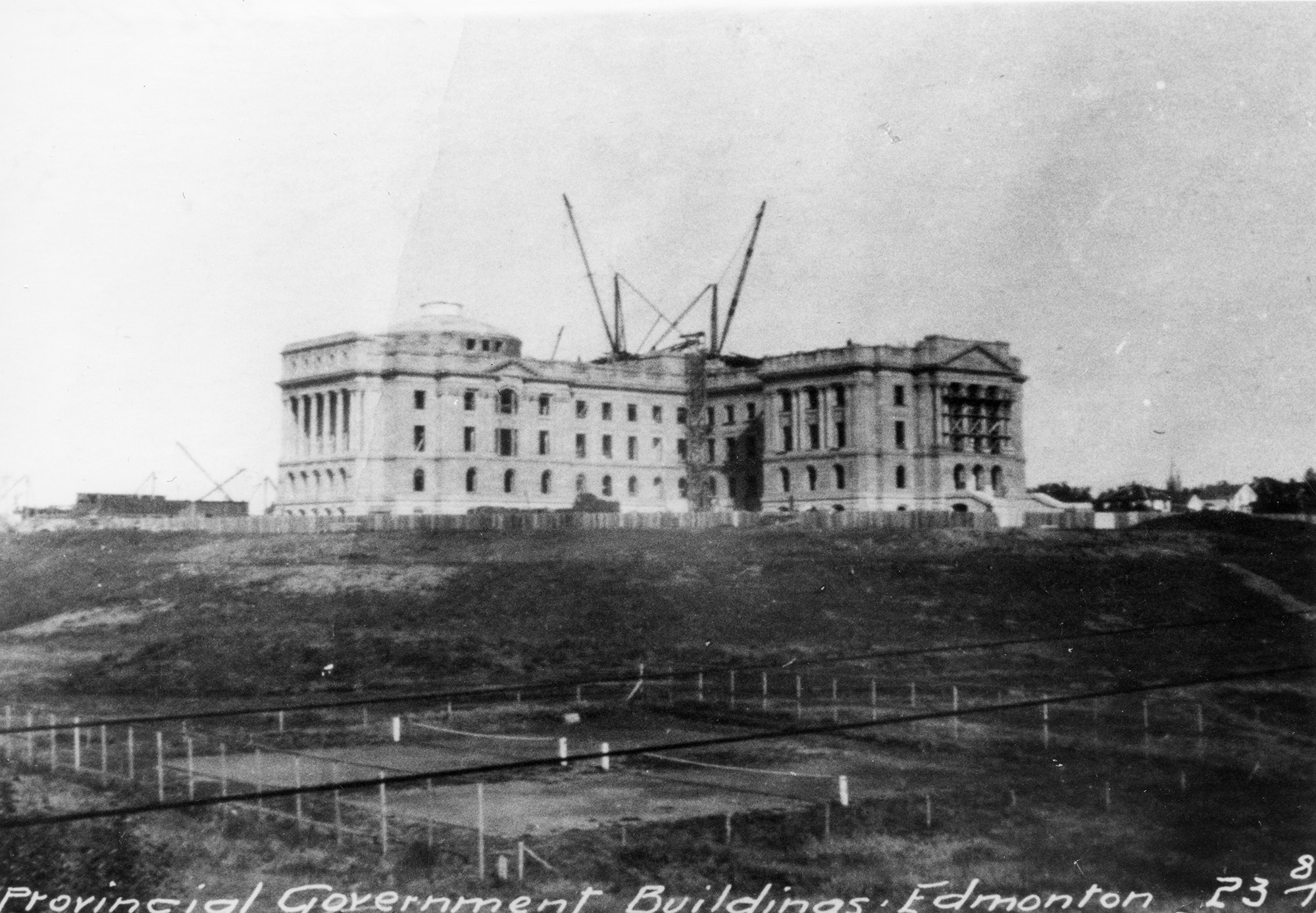 A black and white photo of the Alberta Legislature under construction.