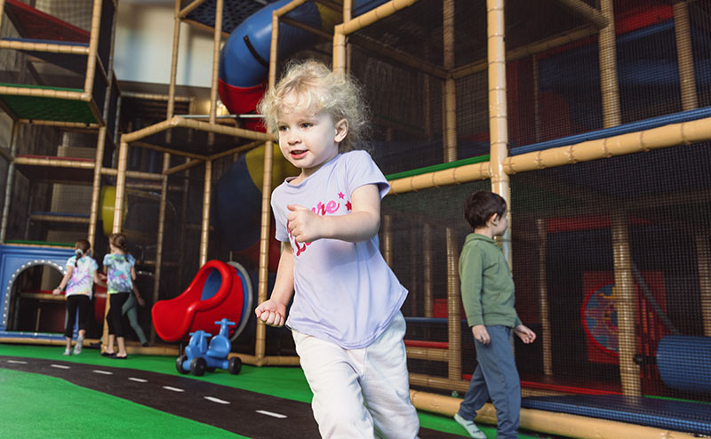 child playing in indoor playground