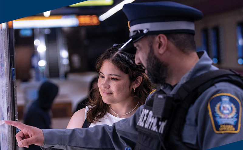 Student and Transit Peace Officer look at transit map