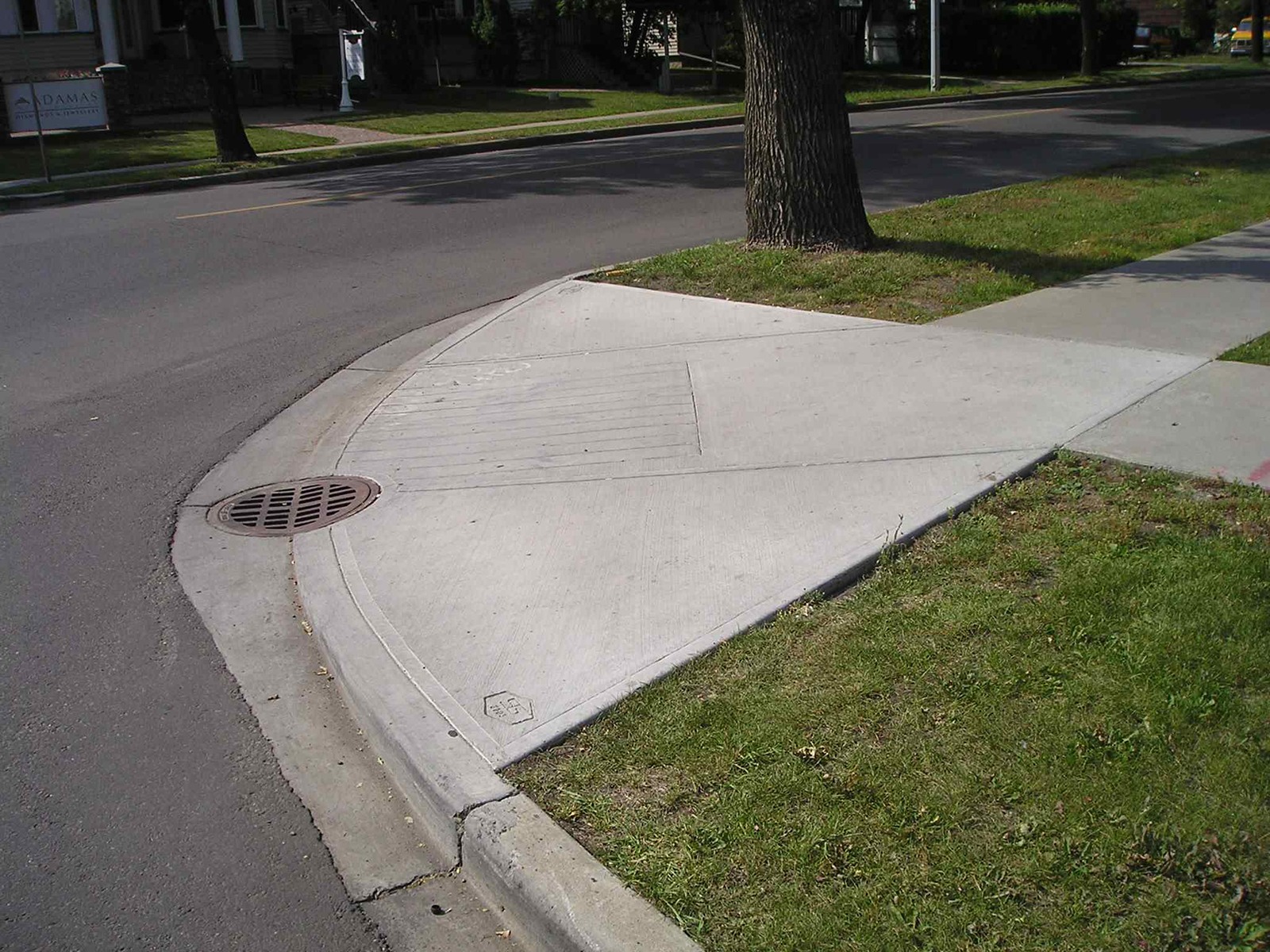A curb ramp at the corner of a road