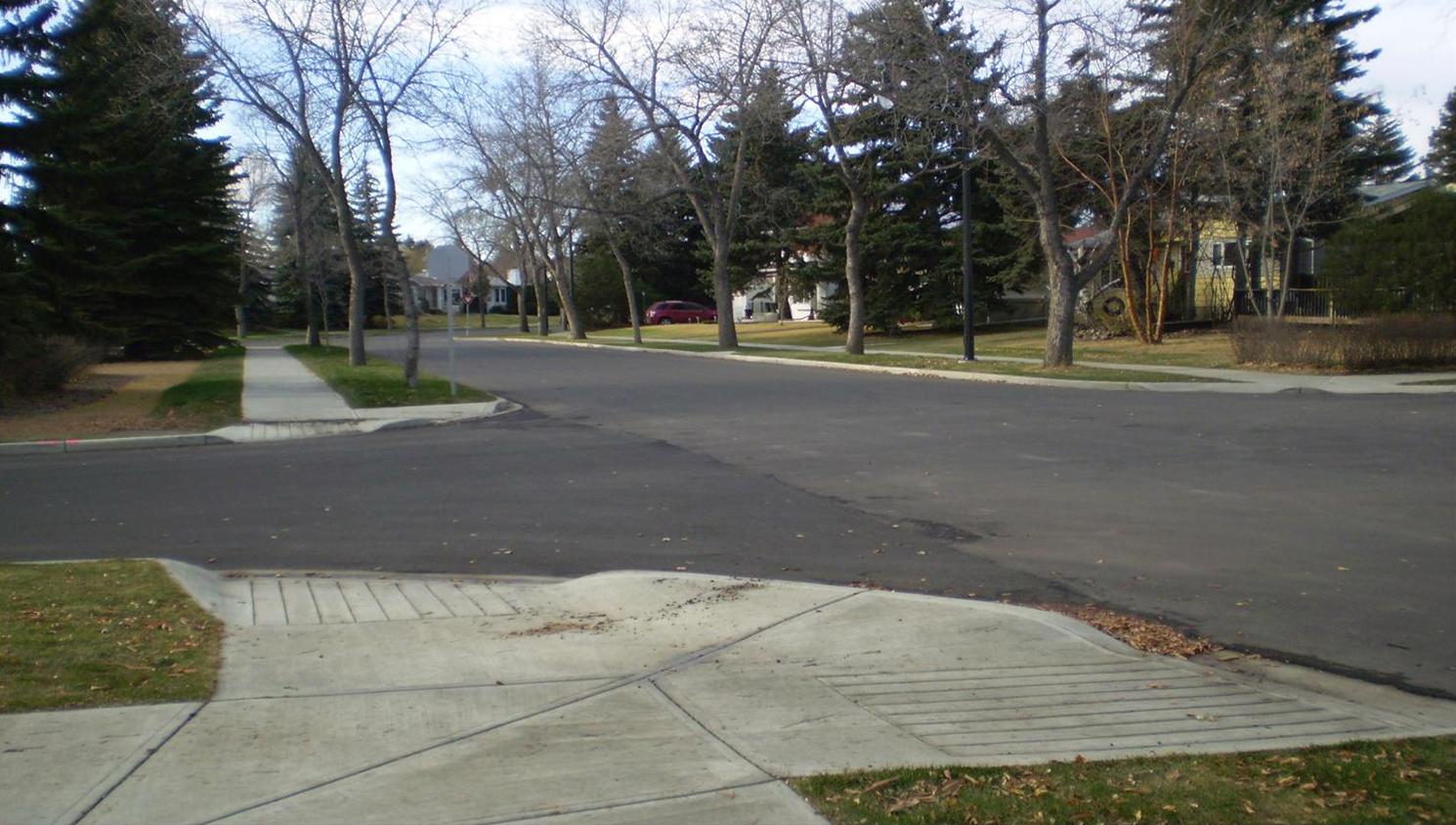 A curb ramp on the corner of the road