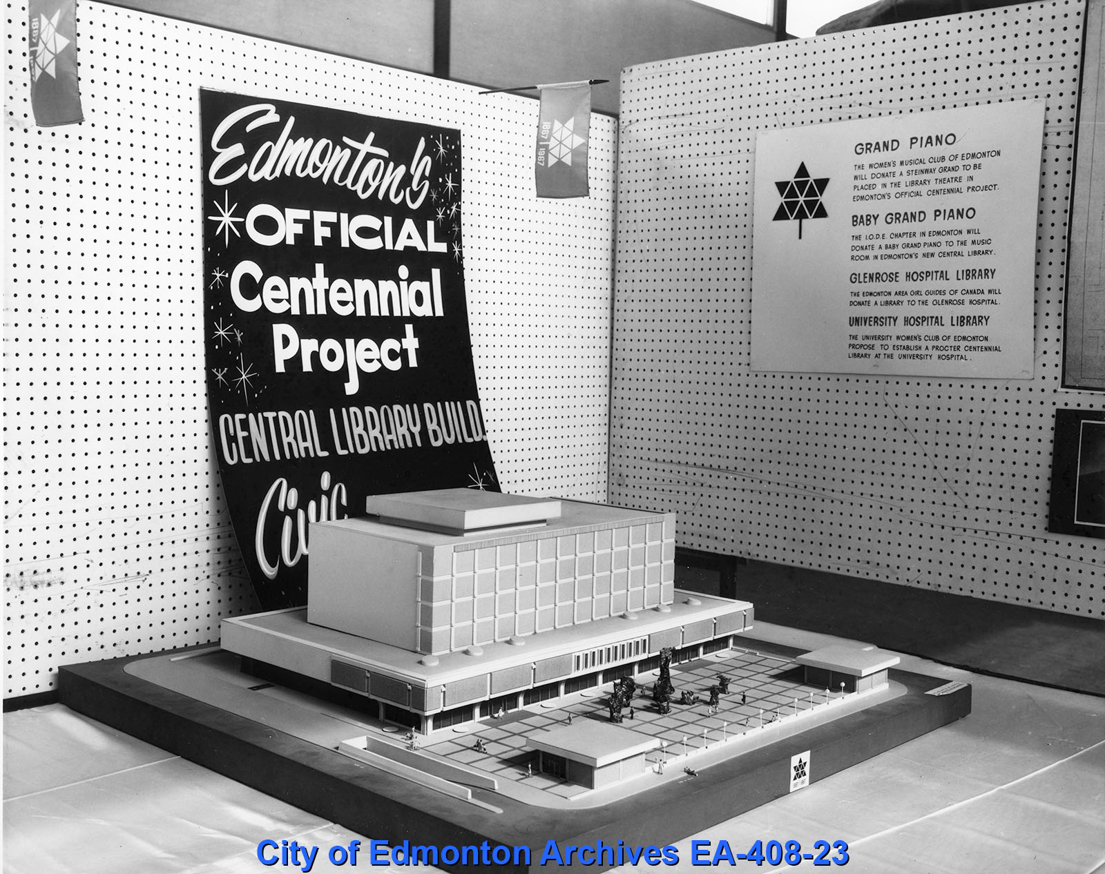 A black and white photograph of a small model of a library.