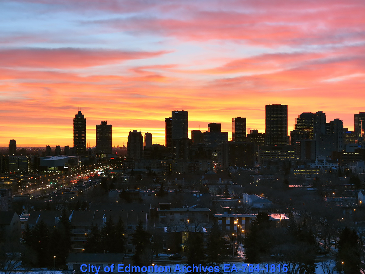 Edmonton's city skyline underneath a vibrant and colourful sunset.