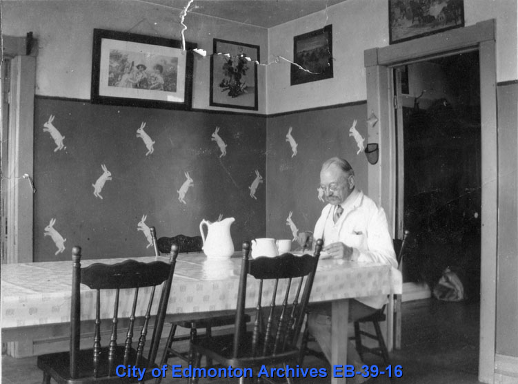 Frederick Humberstone in Farmhouse Dining Room, ca. 1917 [EB-39-16]