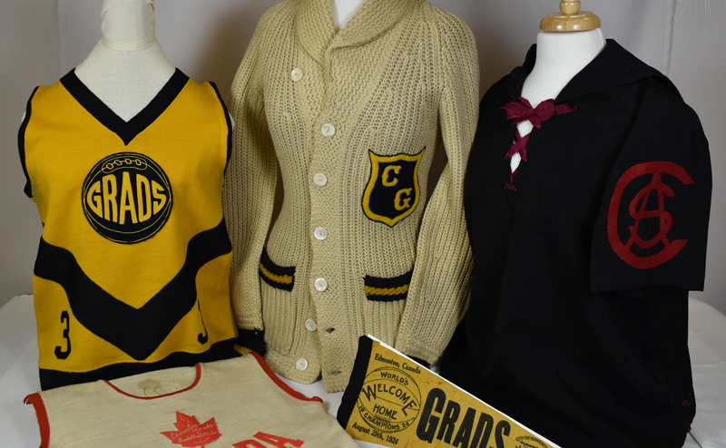 Edmonton Grads uniforms, sweaters and flag on display.