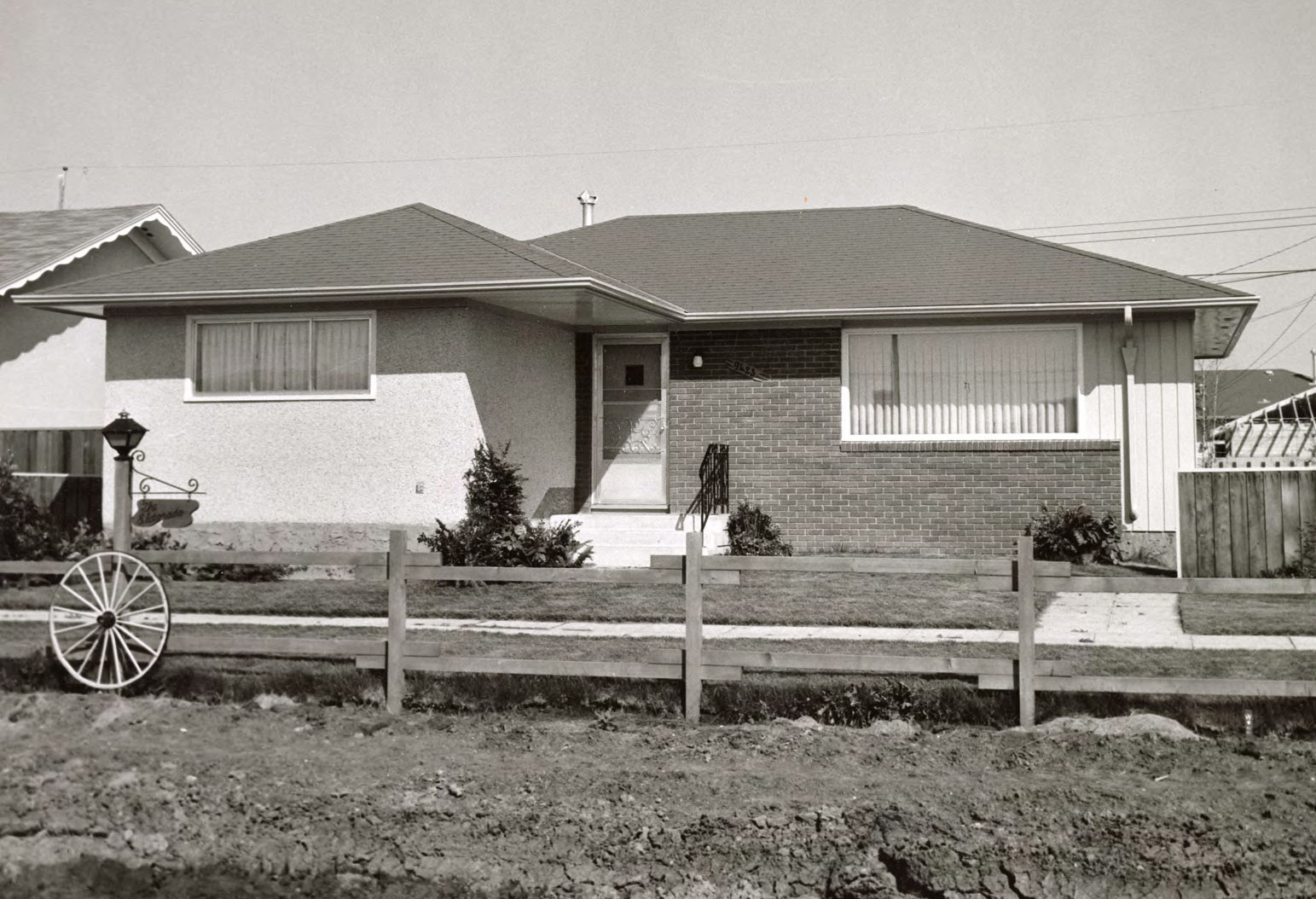 Black and white photo of a built show home.