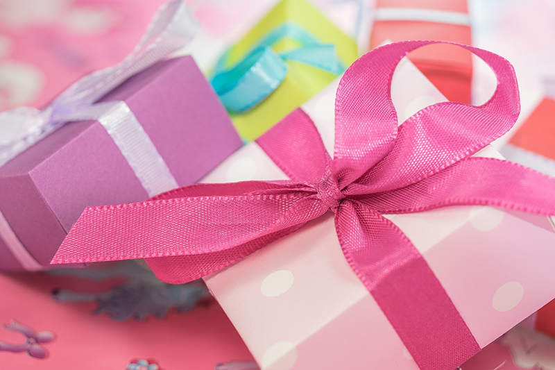 Closeup of wrapped birthday gifts