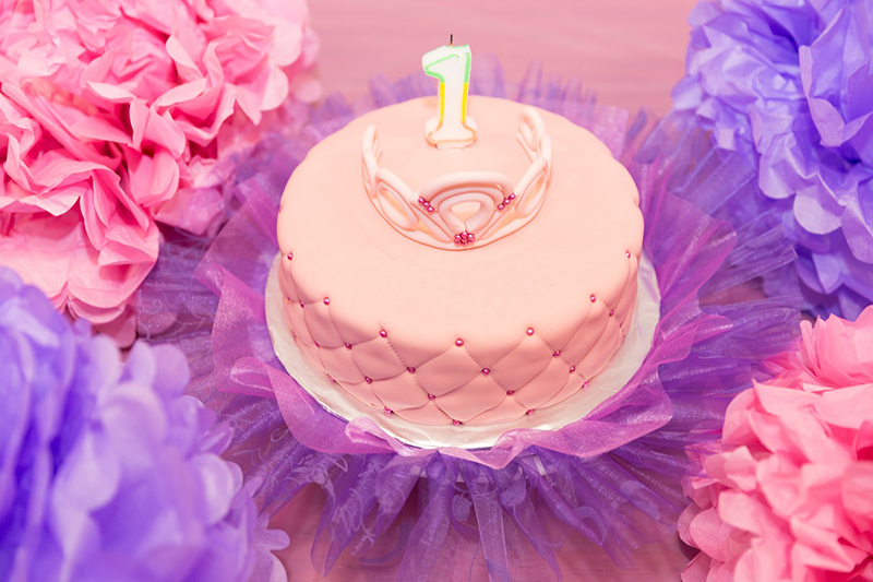 Pink first birthday cake with a tiara