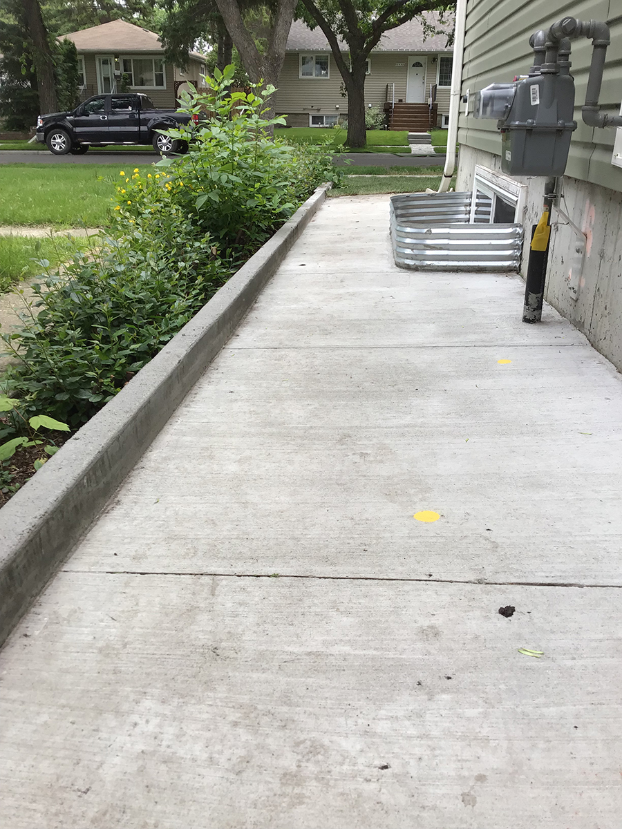 Sidewalk with a curb / retaining wall