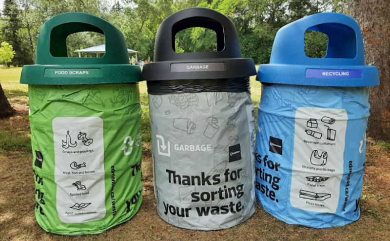 Three waste bins at a picnic site