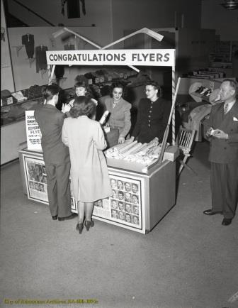 Women handing out Edmonton Flyers souvenirs, 1948